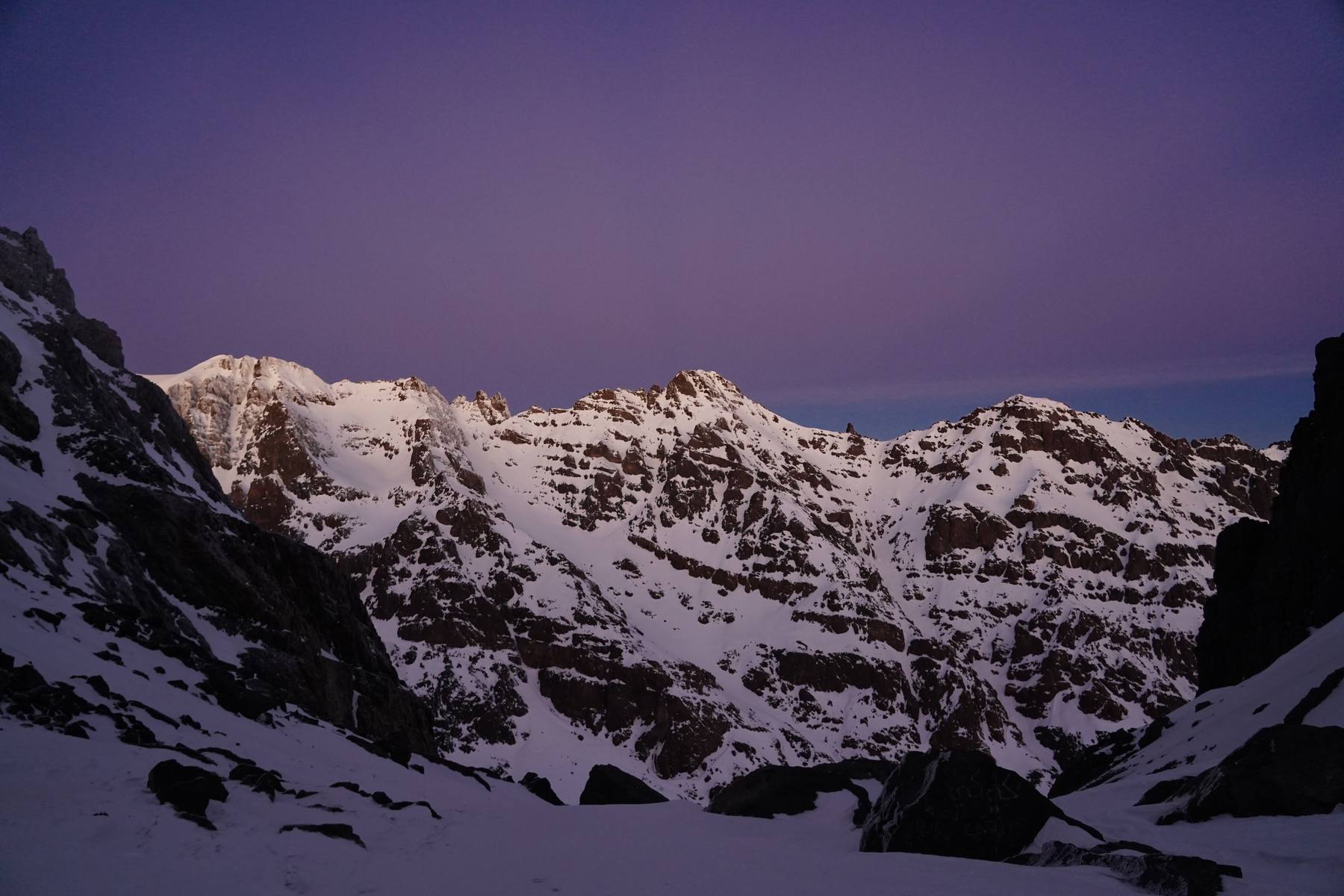 Twilight over snow-covered peaks on an OCMT climb